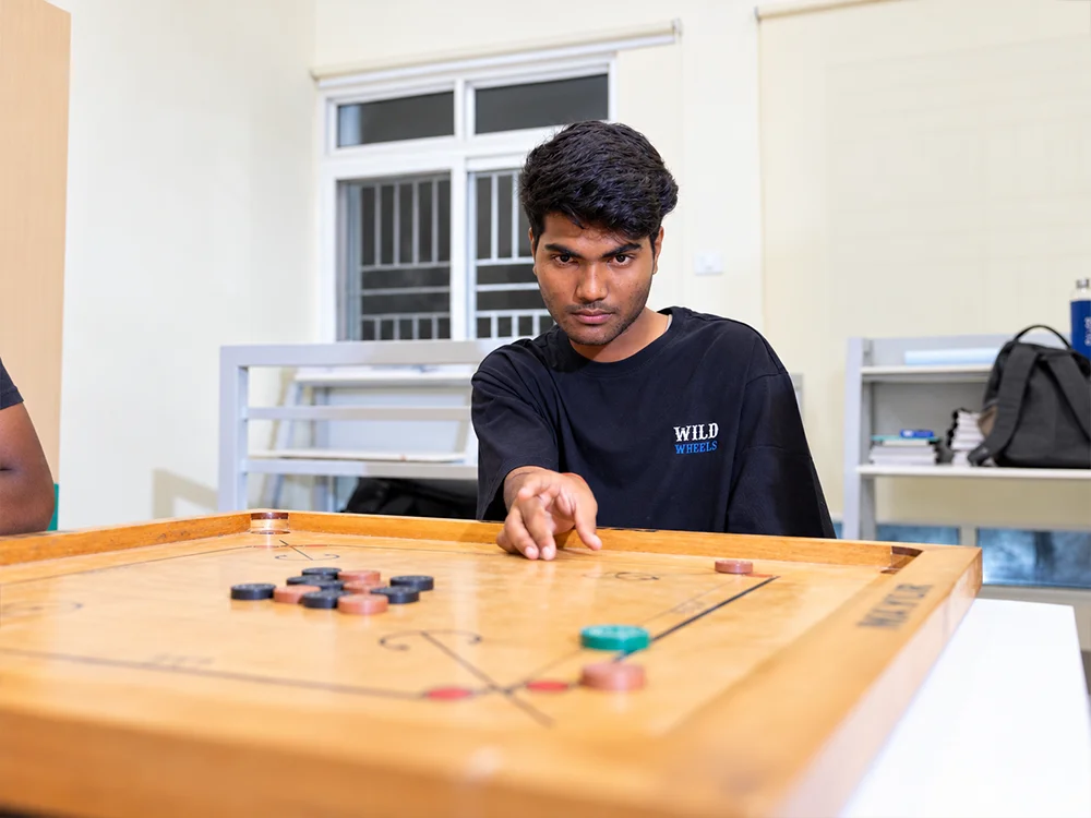 Focused Carrom Player