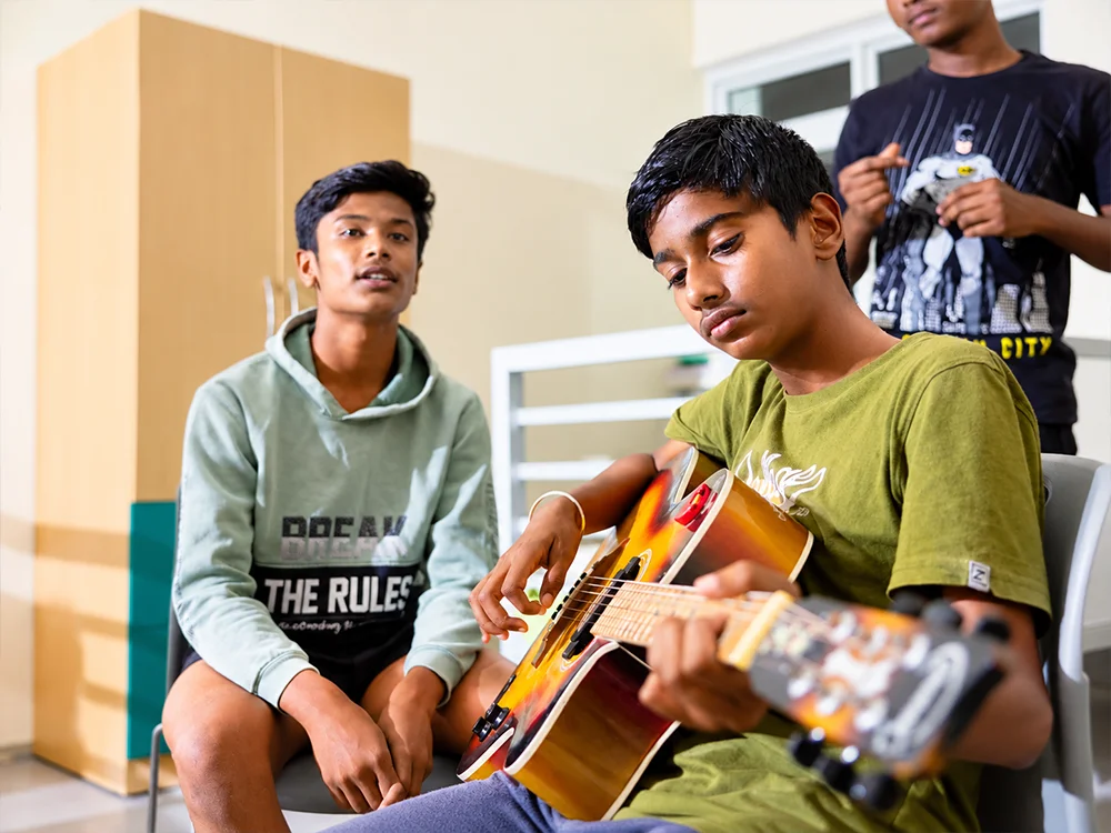 Teen Practicing Guitar