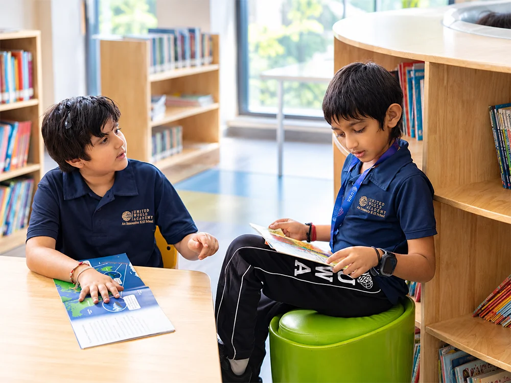 Students reading together in the UWA library
