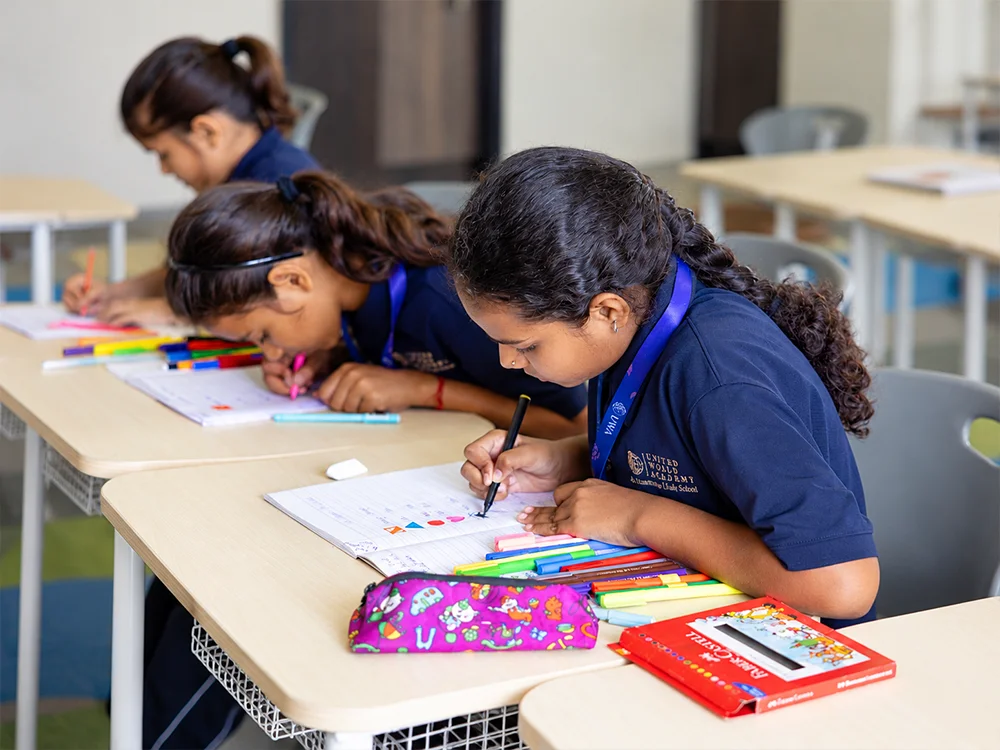 Middle School students writing in class